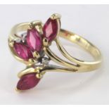 9ct yellow gold spray ring set with four marquise cut rubies and two diamond highlights, size P,