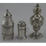 Three silver Peppers, one unmarked Georgian silver Pepper c.1800, one with rubbed hallmarks and