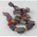 Viking Blue Glass and Carnelian Necklace, ca. 900 - 1100 AD, including a bronze bell pendant. Nice