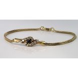 9ct gold spiga link bracelet with central panel set with sapphire and cubic zirconia, weight 5g.