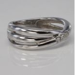14ct white gold three band ring set with three diamonds totalling 0.11ct, size P, weight 4.8g.