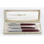 Parker 51 burgundy fountain pen, ballpoint pen & pencil set with chome coloured lids, contained in