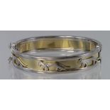 14ct yellow and white gold bangle with panther motif, box and tongue clasp and safety catches,