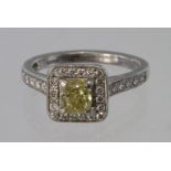 Platinum diamond cluster ring, principal central yellow diamond GIA certificate states 1.03ct