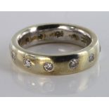 9ct white gold full eternity ring set with twelve diamonds, size M, weight 8.0g.