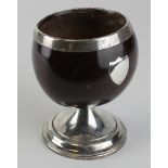 White metal (tests as silver) mounted coconut shell goblet, with shield plaque to side (possibly