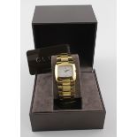 Gucci gold plated wristwatch 8500L stamped on back of case, the white oblong dial with gilt baton