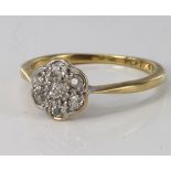 18ct and platinum diamond daisy cluster ring, size M, weight 2.4g.