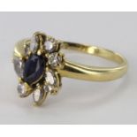 18ct yellow gold sapphire and diamond cluster ring consisting of central marquise shaped sapphire