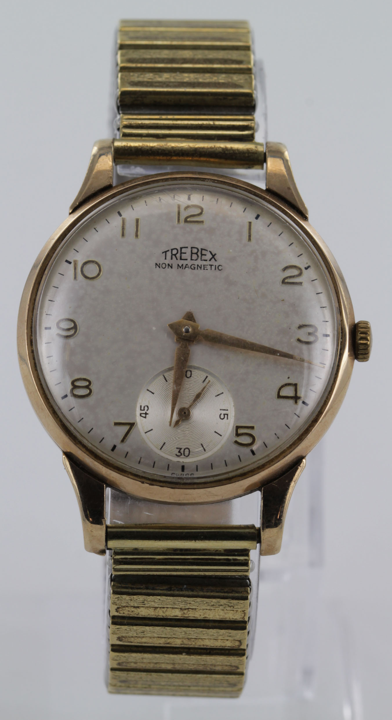 Gents "Trebex" 9ct cased wristwatch, the cream dial with gilt arabic numerals and subsidiary