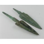 Pair of Bronze Age Arrow Heads, C. 1200 - 800 B.C. Cast bronze arrowheads with integral tangs.