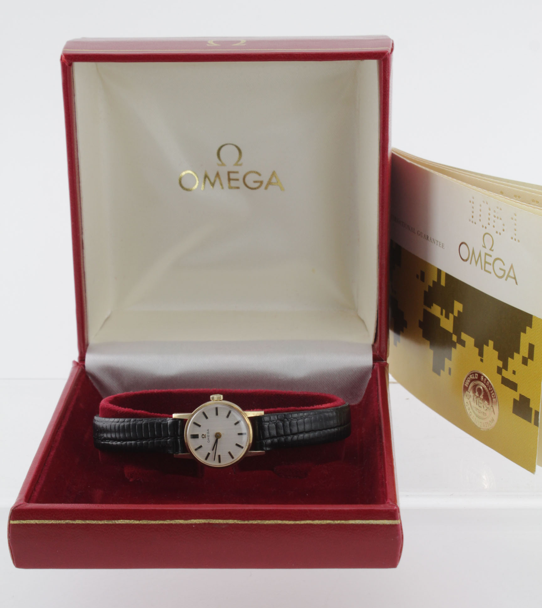 Ladies 9ct gold cased Omega wristwatch (serial number 35936026) the champagne dial with gilt baton