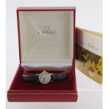 Ladies 9ct gold cased Omega wristwatch (serial number 35936026) the champagne dial with gilt baton