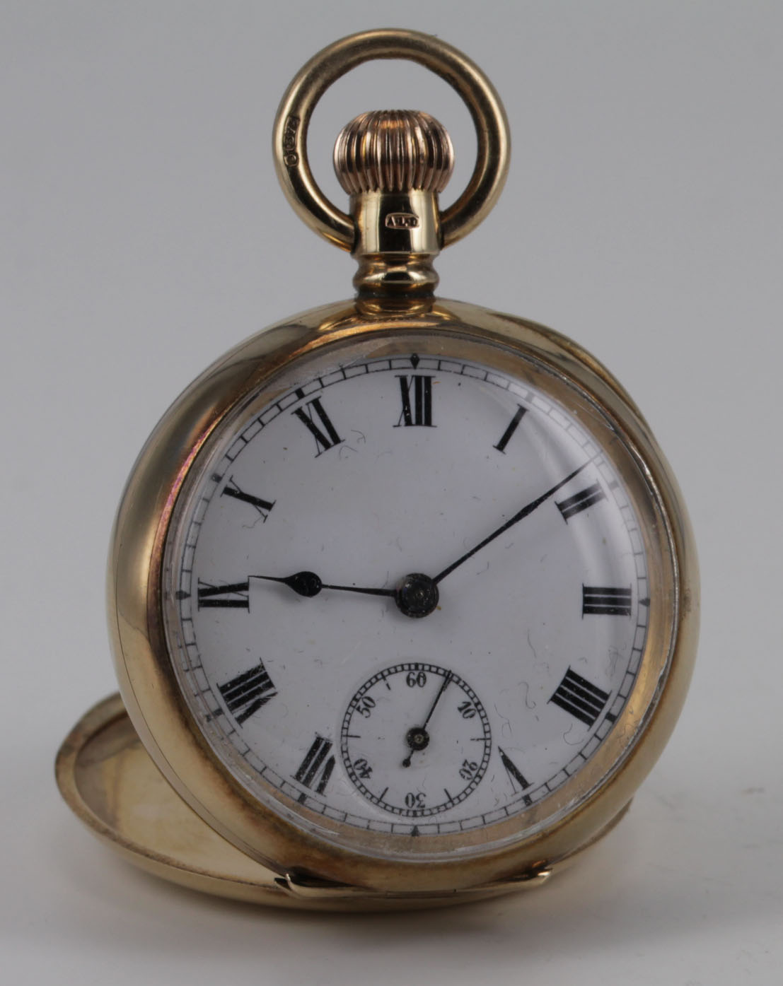 Mid-size 9ct cased open face pocket watch, hallmarked Birmingham 1912. The white dial with black