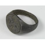 Medieval French Fleur de Lys Ring, ca. 1400 AD, oval band with integral bezel depicting floral