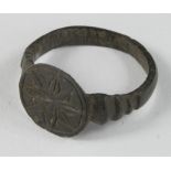 Medieval Ring with Holy Cross, ca. 1000 AD, oval shaped band with round bezel; nicely engraved