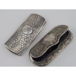 Two silver spectacle cases, both with engraved decoration, one with initials to lid, length 105mm