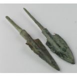 Pair of Bronze Age Arrow Heads, C. 1200 - 800 B.C. Cast bronze flat-barbed and rhombic arrowheads.