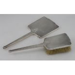 Two silver mounted, engine turned, Art Deco items comprising hand mirror and hair brush, good