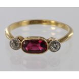 18ct gold ring set with oval ruby and two old cut diamonds, size R, weight 2.9g