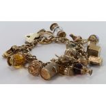9ct Charm bracelet with a good variety of charms attached. total weight 83.7g