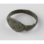 Saxon Evil's Eye Ring , ca. 700 AD, oval shaped band with integral eliptical bezel engraved with sun