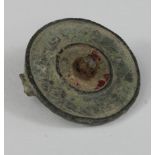 Ancient Roman Disc Brooch, ca. 300 AD Roman enamelled disc brooch with traces of original red