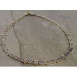14ct yellow and white gold collar necklace with Greek key design, weight 44.3g.