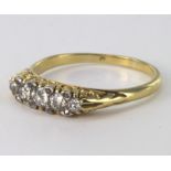Yellow metal (tests 18ct) five stone Diamond Ring size P weight 3.5g