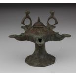 Seljuk Dynasty Bronze Oil Lamp, C. 1037 - 1194 A.D. Seljuk Bronze Multi-Spout Oil Lamp with twin