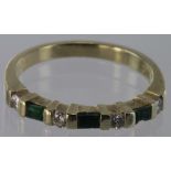 14ct yellow gold half eternity ring set with three baguette cut emeralds and four round brilliant