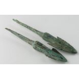 Pair of Bronze Age Arrow Heads, C. 1200 - 800 B.C. Cast bronze arrowheads with integral tangs.