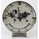 Chrome cased clock on stand by Kienzle International (German), depicting the 'World' to dial, with