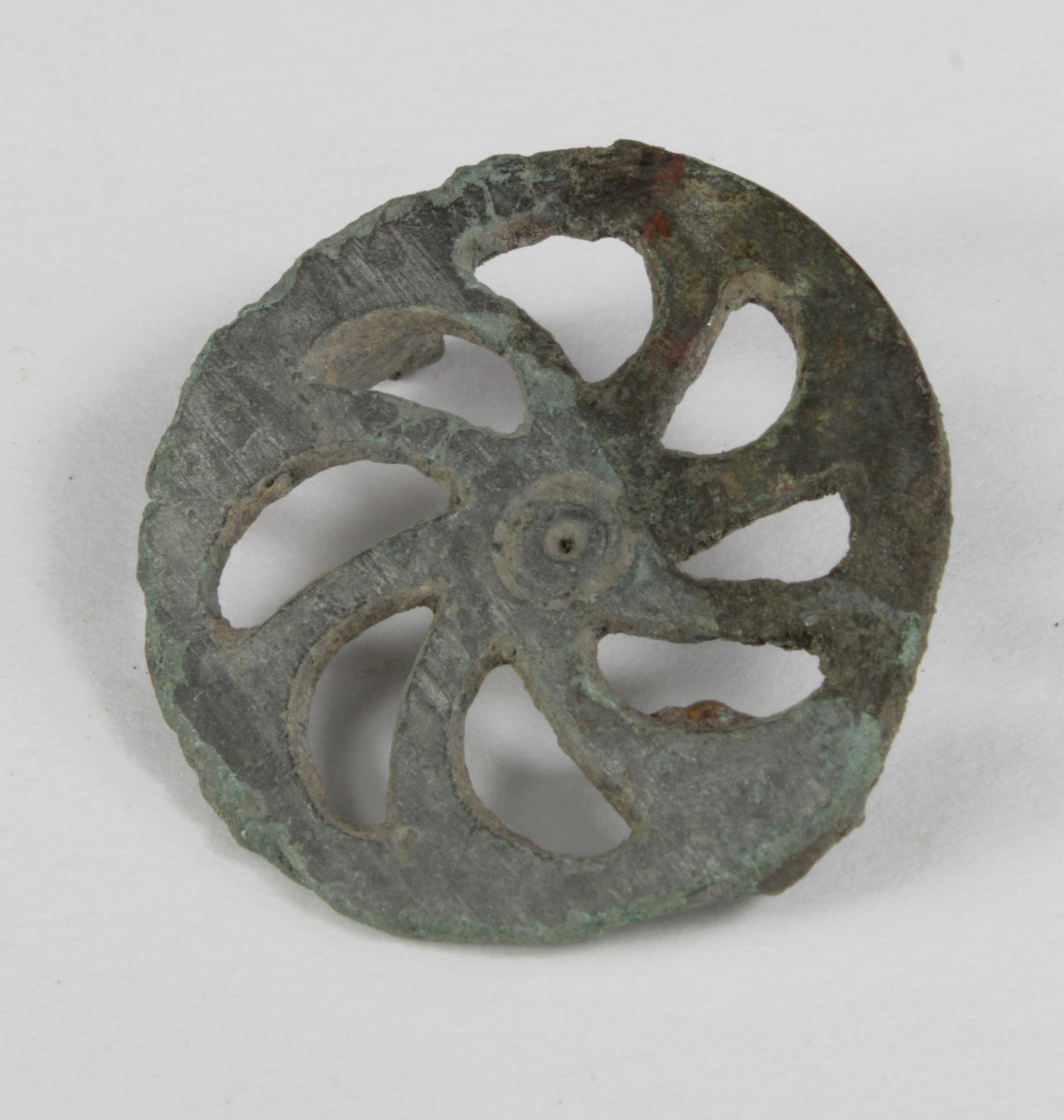 Roman Wheel of Fortune Fibula , C. 200 A.D. Good condition with green ancient patina. 31 mm.