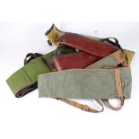 Gunslips in good condition, 2 with sheepskin linings. With carrying straps. (4)