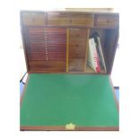 Coin Cabinet, a large collecting cabinet with key. Veneered chipboard, but with many trays and