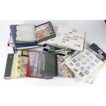 Black banana box tray packed with various albums, loose pages. Lots of World stamps noted (qty)