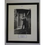 George Best, 9.5 x 14 photo of Best outside his childhood house No.9, 1965 by Popperfoto, over