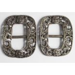 Gerorgian shoe buckles in silver? with two gorgeions heads on each, one cracked across one side [2]