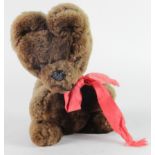 Musical teddy bear with rotating head in a circular motion, height 24cm approx.