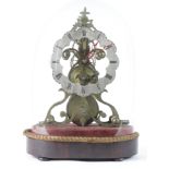 Brass skelton clock with a silvered chapter ring, circa 19th Century, mounted on a wooden plinth,