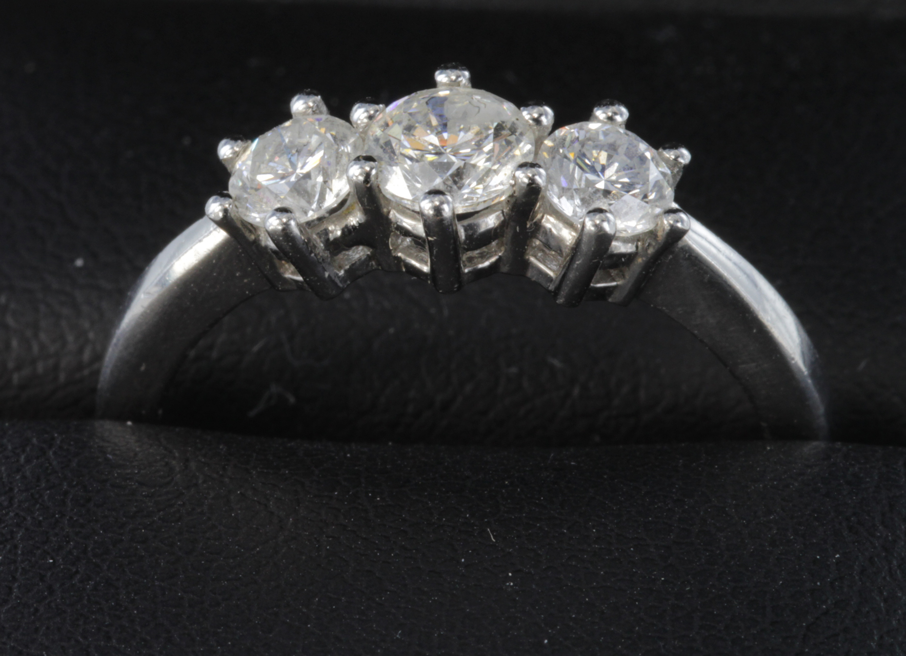 18ct white gold diamond trilogy ring total diamond weight 1ct, size P, weight 4.5g.