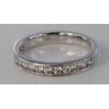 18ct white gold diamond half eternity ring, size M, weight 3.6g.