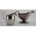 Silver milk jug with engraved decoration, hallmarked 'London 1800' (makers mark rubbed), a few