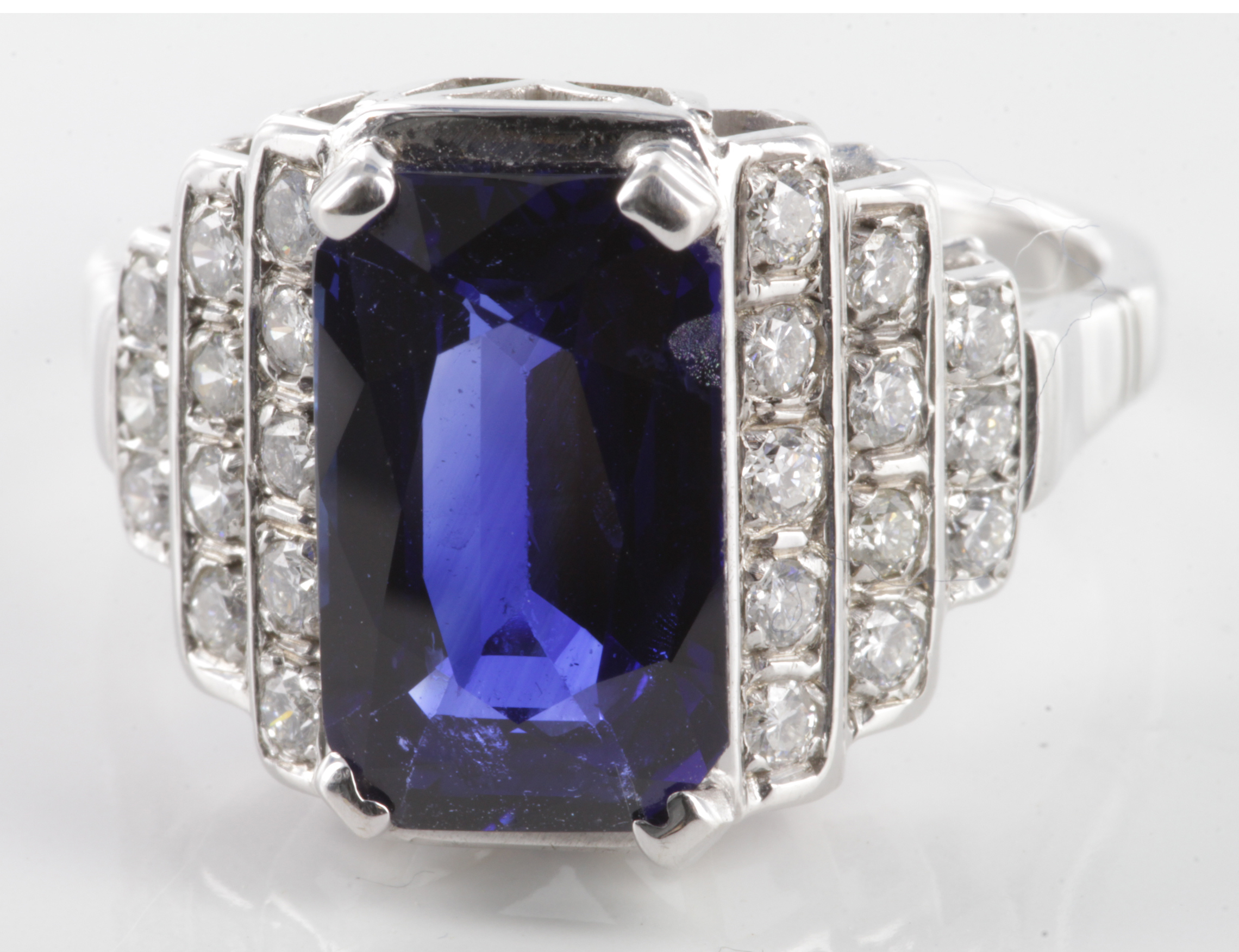 18ct white gold fine emerald cut sapphire dress ring with step down diamond shoulders, size N,