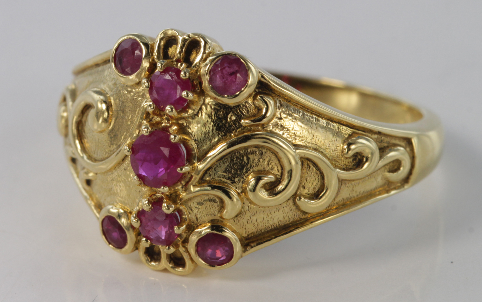 18ct Gold Ring set with seven Rubies size N weight 5.2g