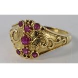 18ct Gold Ring set with seven Rubies size N weight 5.2g