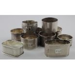 Ten silver napkin rings - various hallmark dates - includes a Masonic example and an unmarked Indian