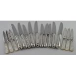 Ten silver handled knives (six table and four dessert) Hallmarked on handles for London 1962. Plus