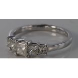 18ct white gold princess cut five stone ring, total diamond weight 0.82ct, size N, weight 2.6g.